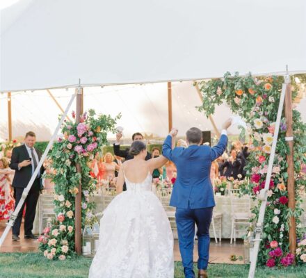 bride and groom entering wedding reception